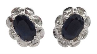 Pair of gold sapphire and diamond stud earrings