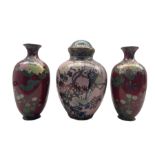 Japanese Cloisonne vase and cover decorated with an exotic bird perched on a branch amongst wisteria