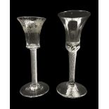 18th century cordial glass with waisted bucket shape bowl etched with vines on an air twist stem and