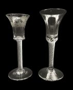 18th century cordial glass with waisted bucket shape bowl etched with vines on an air twist stem and