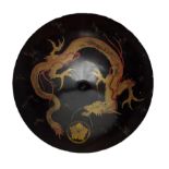 19th century Japanese black lacquer shield decorated with a mon and gilt dragon