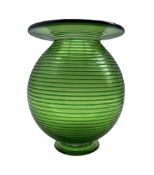 Bob Crooks (British 1965-): A green art glass vase of globular form with blue spiral decoration and