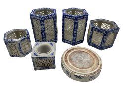 Pair of Chinese blue and white reticulated candle lanterns or vases of hexagonal form