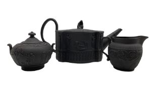 19th century black basalt teapot with female knop handle and the body moulded with Classical figures