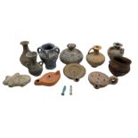 Three Roman style terracotta oil lamps