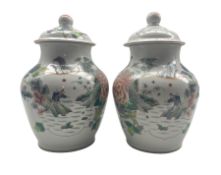 Pair of 19th century Chinese Qing dynasty vases and covers decorated with figures