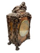 A 19th century carved walnut bracket clock and associated bracket