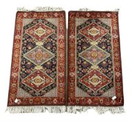 Pair of Persian ground rugs