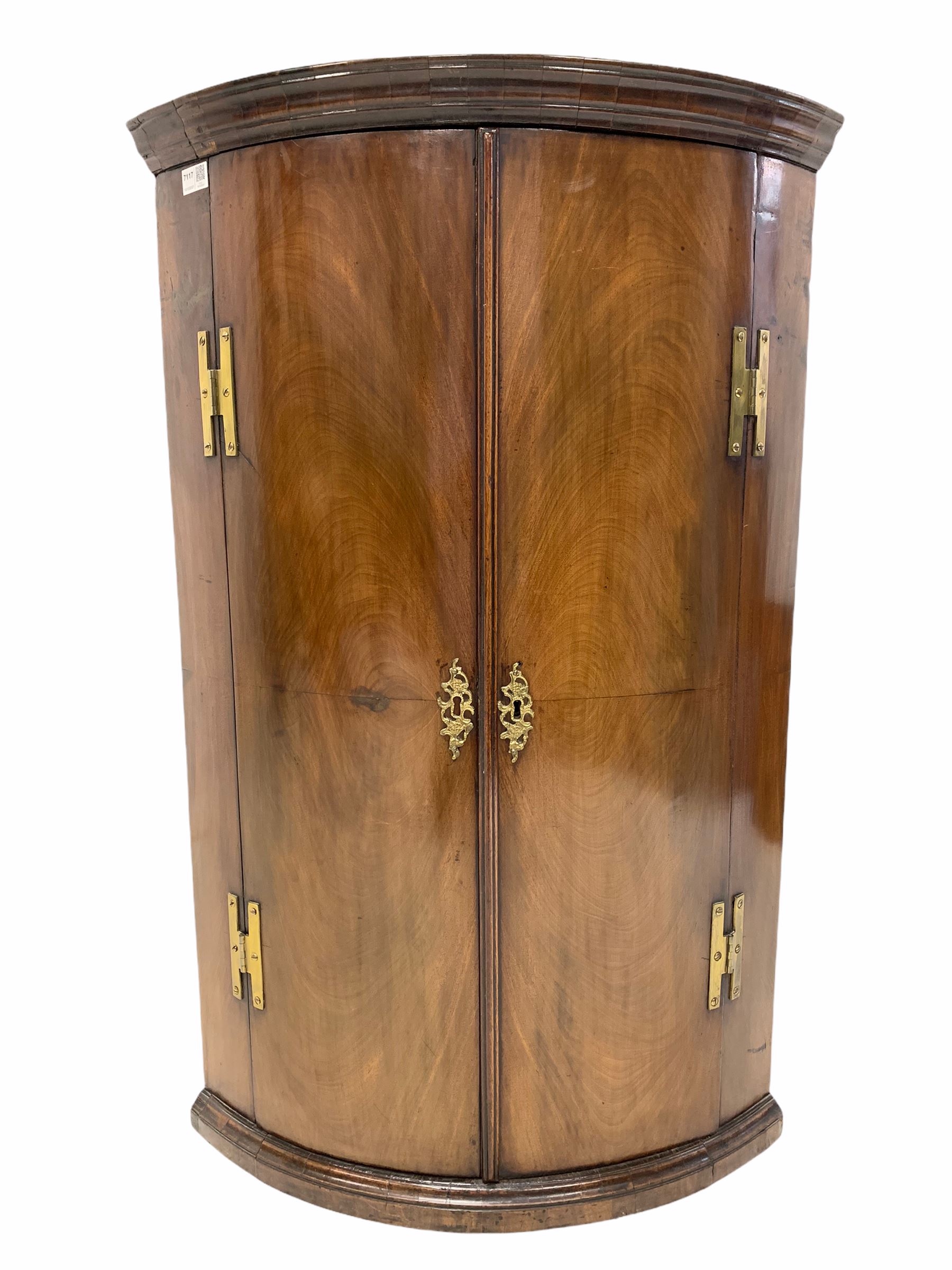 George III mahogany bow front corner cupboard