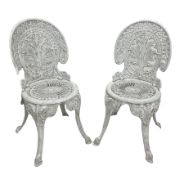 Pair of Victorian style white painted cast aluminium garden chairs