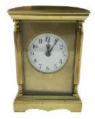 A late 19th century Parisian spring driven table clock with four bevelled glass panels