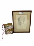 Unsigned head and shoulders pencil portrait of a lady and a small Victorian photograph album in moth