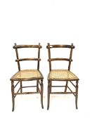 Pair of early 20th century beech side chairs with cane seat panel