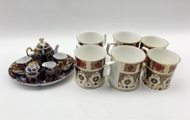 Roselle OCC & Co. miniature Imari pattern cabaret set and six Imari pattern tankards