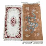 Indian wool white gound rug with floaral design (145cm x 72cm) together with a Chinese brown ground