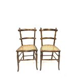 Pair of early 20th century beech side chairs with cane seat panel