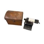 Imperial typewriter and a painted metal trunk