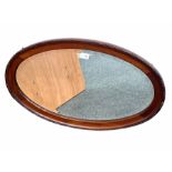 Early 20th century mahogany framed oval wall mirror with bevelled plate 78cm x 48cm