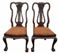 Pair of mahogany lyre back dining chairs with drop in upholstered seat pads and ball and claw front