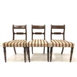Set of four Victorian mahogany dining chairs with upholstered seats and turned front supports