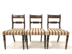 Set of four Victorian mahogany dining chairs with upholstered seats and turned front supports