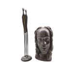 African carved bust of a man and a contemporary bronze sculpture of an ambiguous stylised couple by