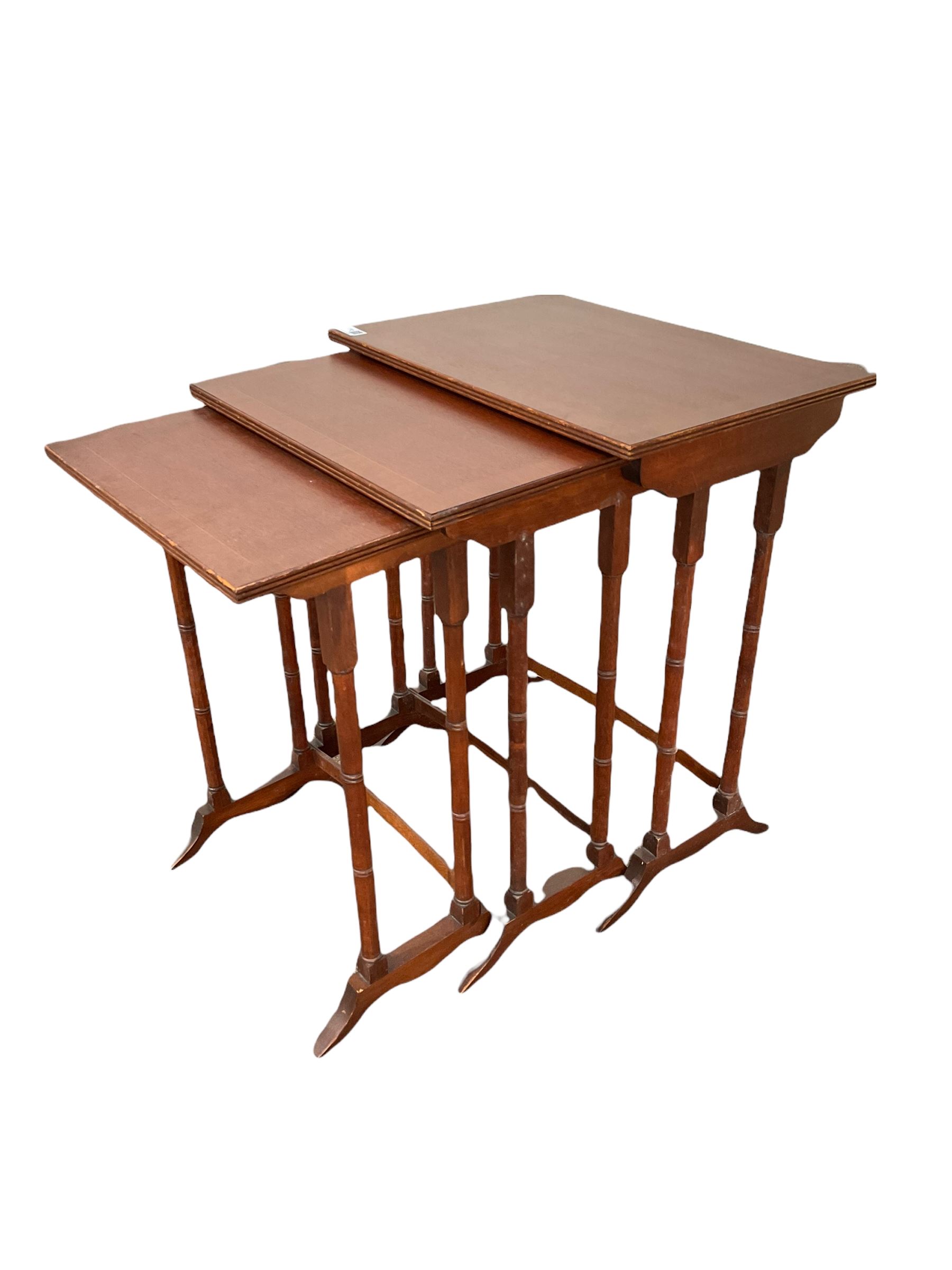 20th century mahogany nest of tables with cross banded tops and raised on ring turned supports