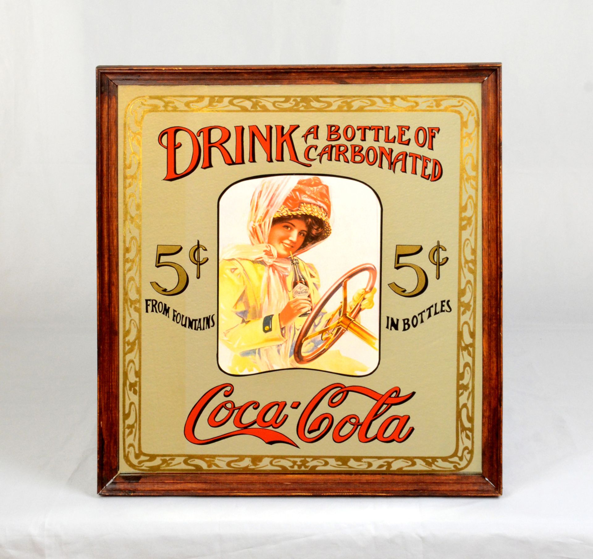 Advertisement on mirror "Drink a bottle of carbonated Coca-Cola"