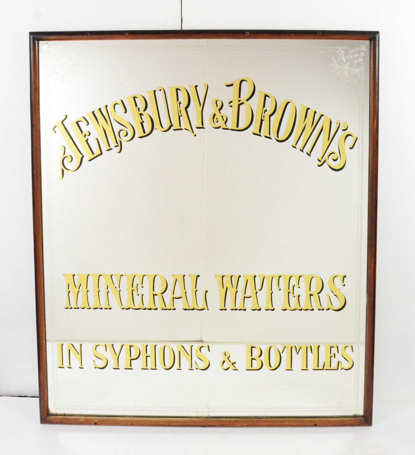 Jewsbury & Brown's advertisement on large mirror