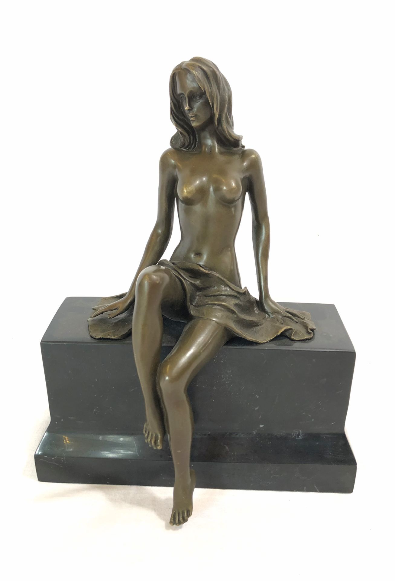 Bronze statue of a woman by artist Claude