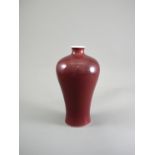 A Copper Red-Glazed Vase, Meiping, Qianlong Period, Qing Dynasty with a tapering body rising to a