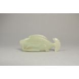 A Well Carved Celadon Jade Carp Brush Rest, 19th Century Size: 7.9x3.2x1.5cm the fish depicted