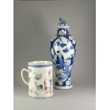 A Blue and White Tall Baluster 'Figure' Vase and Cover, 19th Century; and a Cylindrical Famille Rose