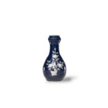 A Blue Ground Slip Decorated 'Chrysanthemums' Zhangzhou Garlic Neck Bottle Vase, Late Ming Dynasty
