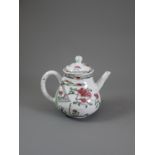 A Famille Rose Pear-Shaped 'Floral' Teapot and Cover,Yongzheng Period, Qing Dynasty W: 14cm,H: