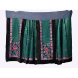 A green silk skirt, embroidered with bright flowers, second half of the 20th century L: 93.5cm, 56cm