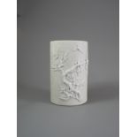 A Cylindrical White Biscuit Brush Pot, 19th Century H: 12.2cm, D: 7.7cm decorated with applied