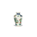 A Wucai baluster jar ,painted in underglaze blue and bright enamels with a scholar, a crane and