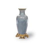 A Pale Blue Glazed Ormolu Mounted Vase, 18th Century H: 33cm, D: 17cm of rouleau form,the streaked