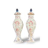 A Slender Pair of Famille Rose Moulded Baluster Vases and Covers, Yongzheng Period, Qing Dynasty