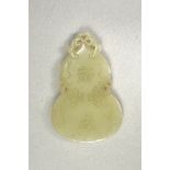 A Celadon Jade Double Gourd Abstinence Plaque L: 7.1cm, W: 4.5cm, H: 0.4cm carved zhaijie on one