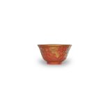 A Fine Carved Coral Glazed 'Dragon' Bowl, c.1800 D: 10.8cm, H: 5.9cm imitating cinnabar lacquer,with