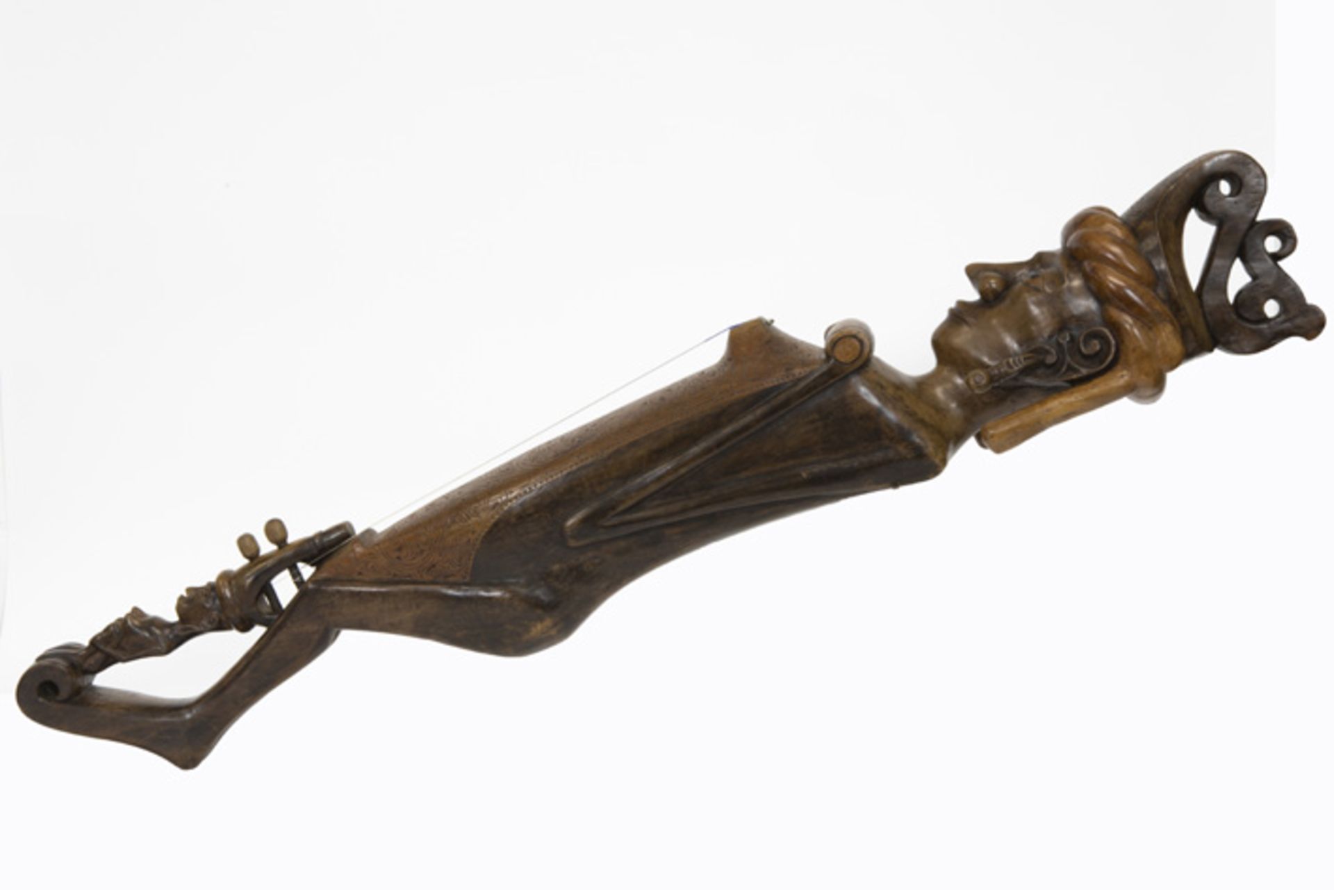 'antique' Indonesian musical string instrument in wood with sculpted ornaments 'Antiek'