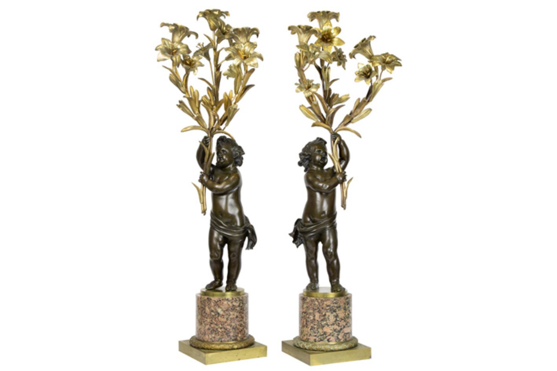 pair of nice 19th Cent. "Cupid" candelabras in partially brown patinated partially gilded bronze