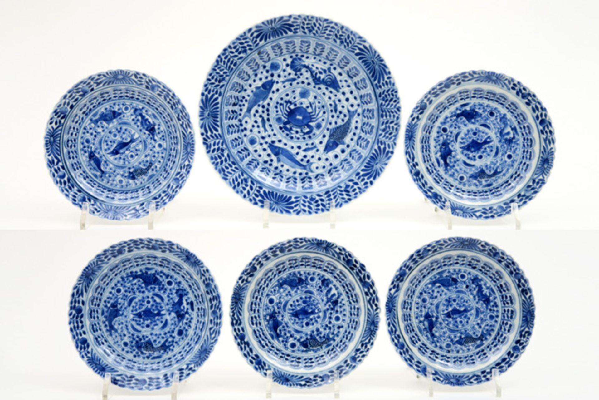 series of five smaller and one bigger 18th Cent. Chinese plates in porcelain with blue-white decor