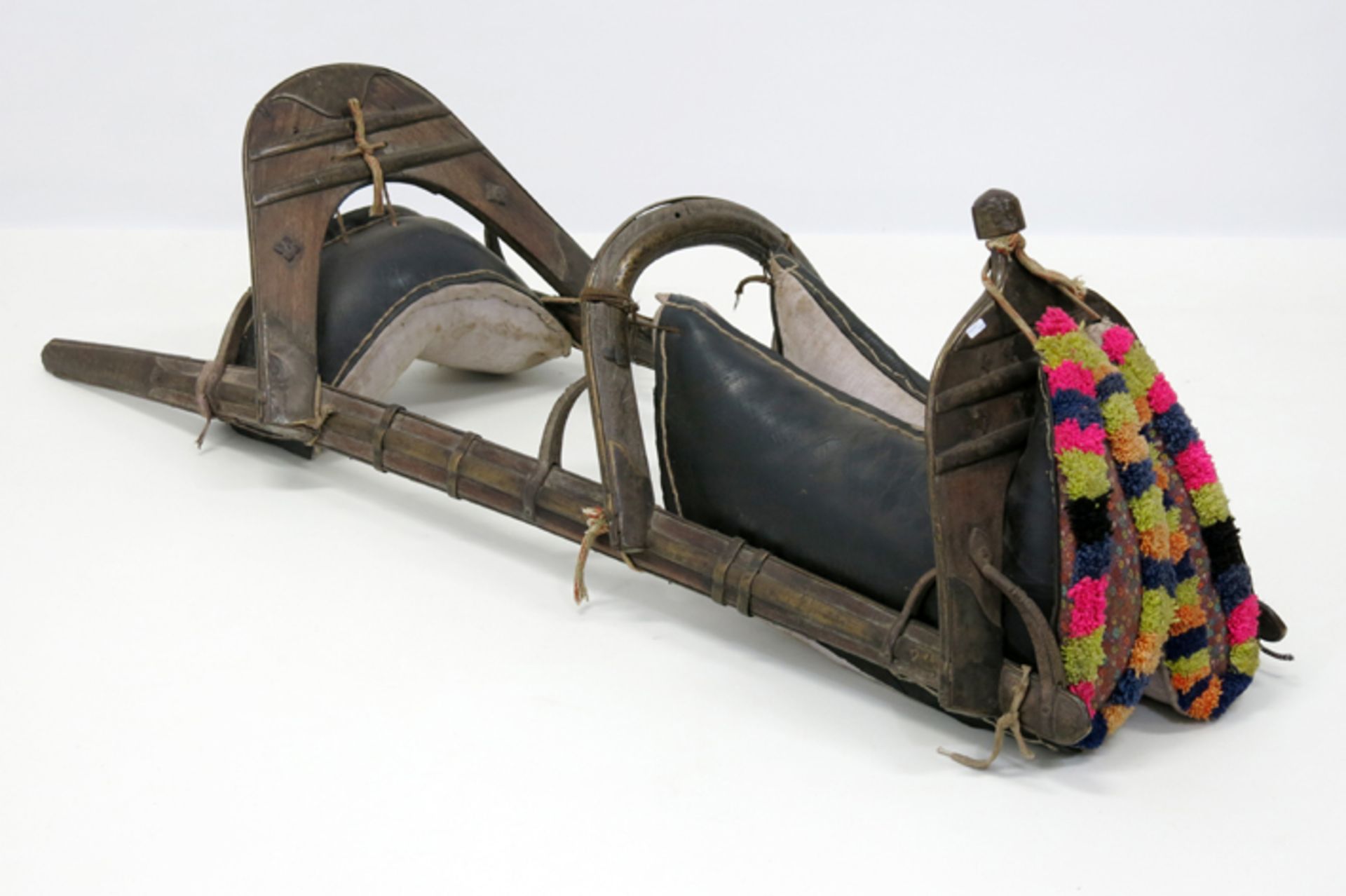 Indian Gujarat camel saddle from the 'Banjara' people in wood with brass INDIA/GUJARAT