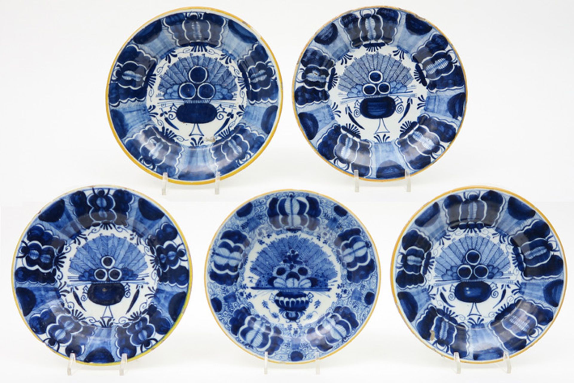 series of five 18th Cent. plates in marked ceramic from Delft with blue-white peacock tail decor