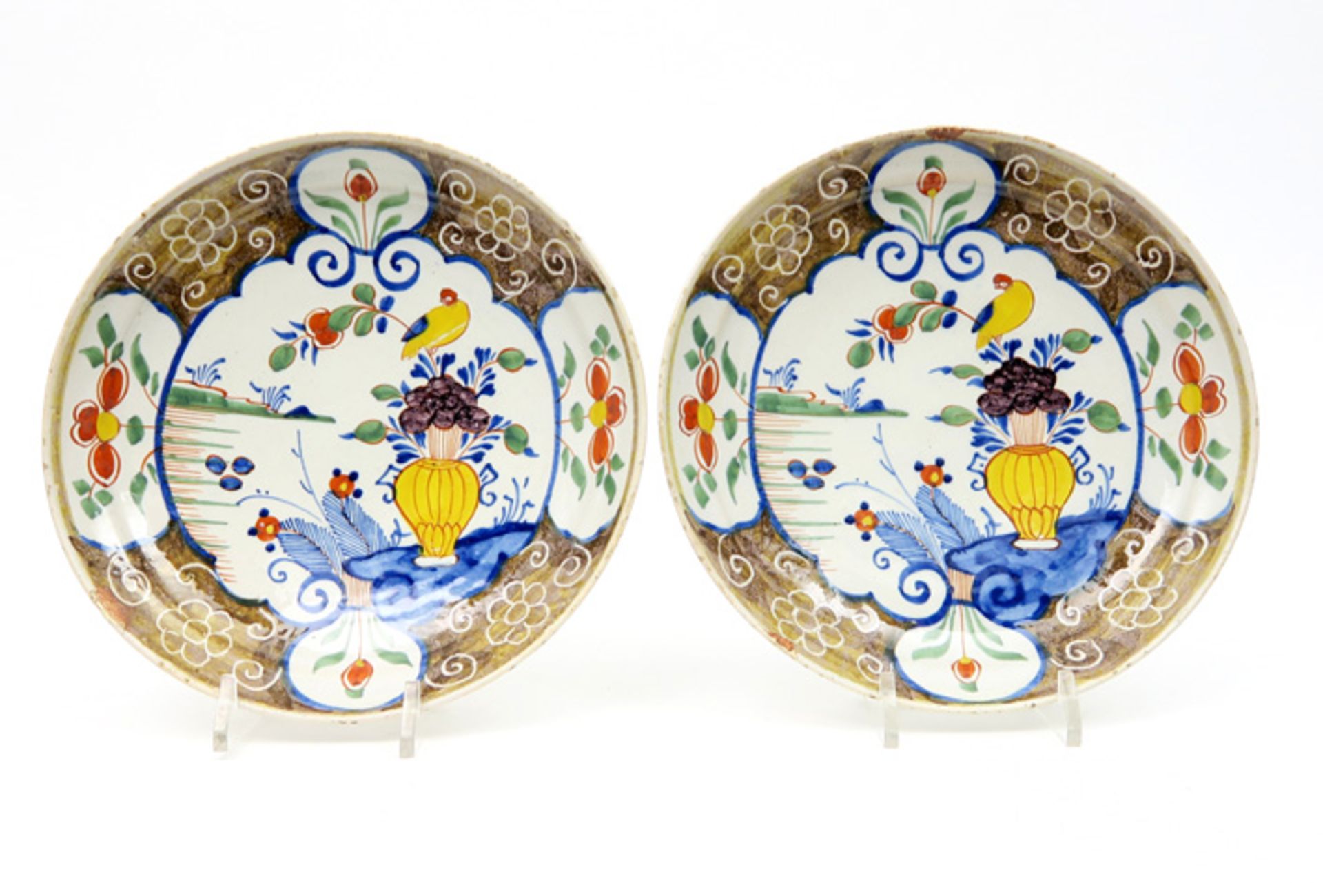 pair of 17th/18th Cent. (pancake)plates in ceramic from Delft with a quite special polychrome