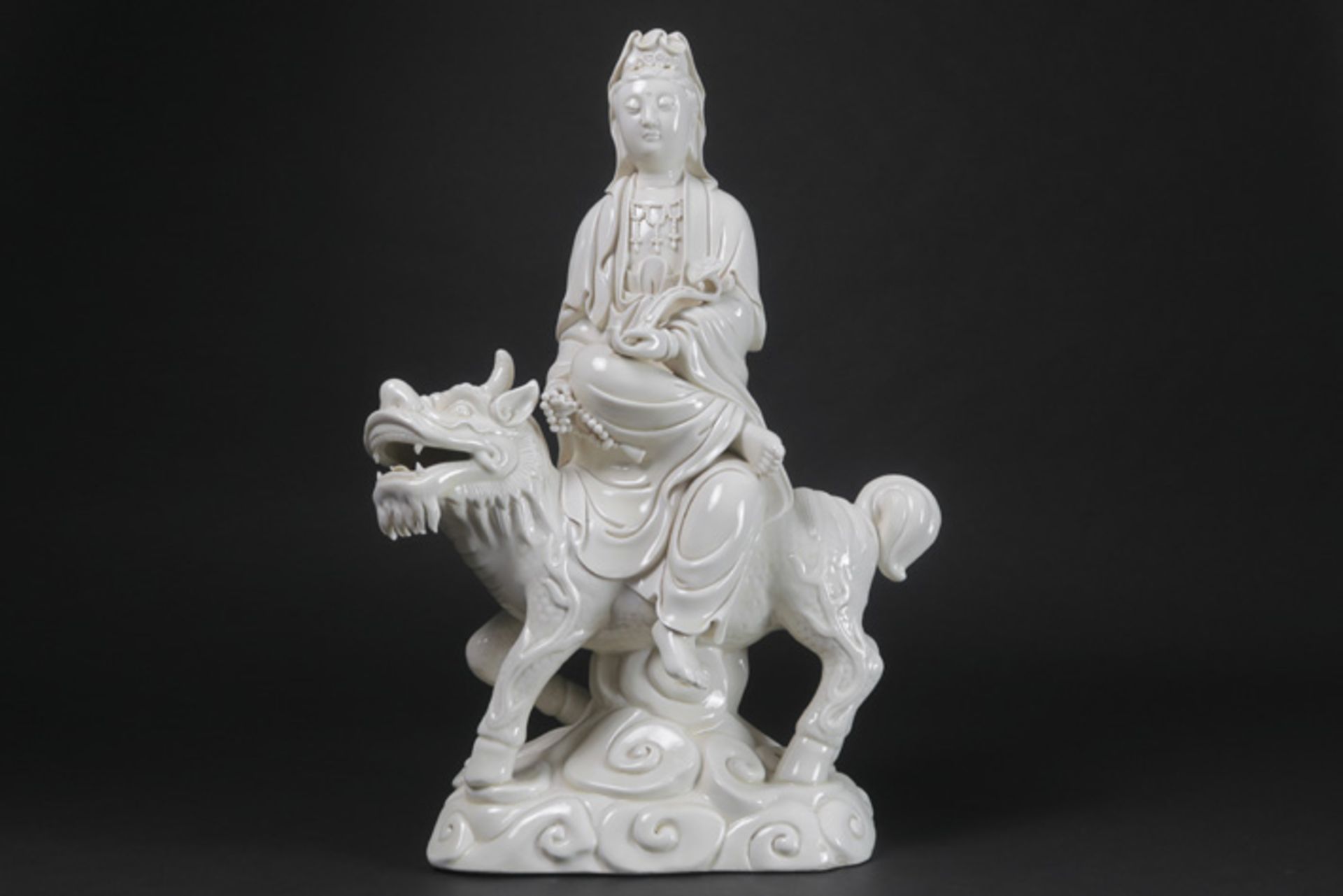 Chinese "Quan Yin on snow lion" sculpture in "blanc de Chine" porcelain Chinese "blanc de Chinese"