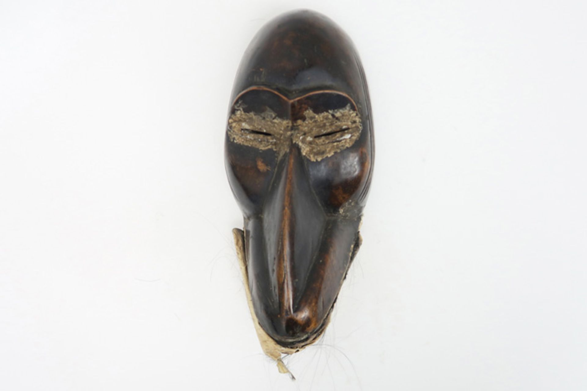 AFRIKA - IVOORKUST "Dan" - masker in hout met mooie patine in de vorm van een sterk gestileerde
